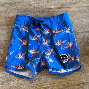 Vibrant‎ Blue Kids Swim Trunks with Tropical Print